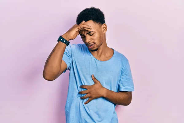Young African American Man Wearing Casual Blue Shirt Touching Forehead — Φωτογραφία Αρχείου
