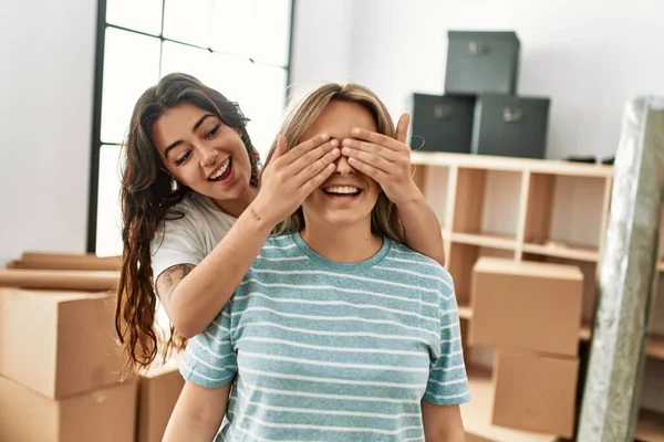 Girl Surprising Her Girlfriend Covering Eyes New Home — Stock Photo, Image