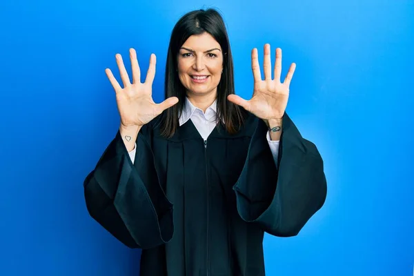 Young Hispanic Woman Wearing Judge Uniform Showing Pointing Fingers Number — Φωτογραφία Αρχείου