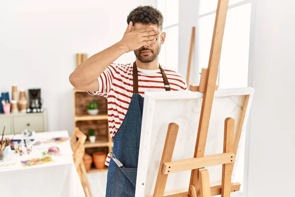 Arab Young Man Art Studio Covering Eyes Hand Looking Serious — Fotografia de Stock