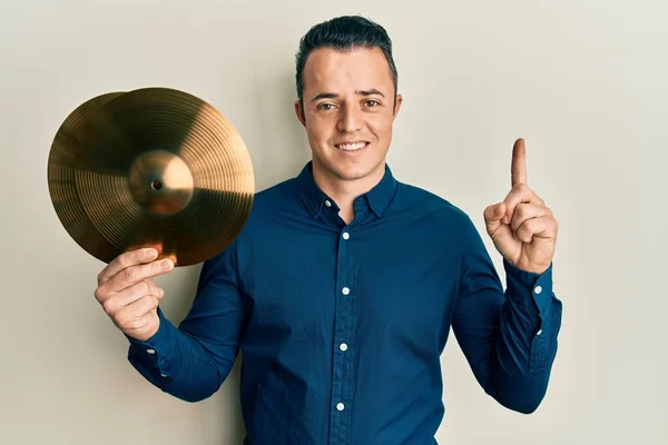 Handsome Young Man Holding Golden Cymbal Plates Smiling Idea Question — Stockfoto