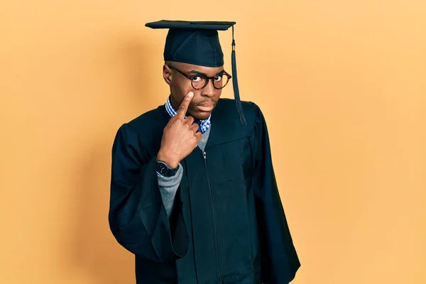 Young African American Man Wearing Graduation Cap Ceremony Robe Pointing — Stock Photo, Image