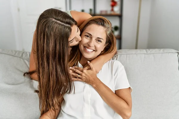 Mother Daughter Kissing Hugging Each Other Sitting Sofa Home — Stockfoto