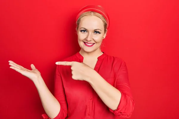 Young Blonde Woman Wearing Casual Red Shirt Amazed Smiling Camera — Stock Fotó