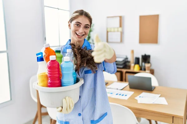Young Blonde Woman Wearing Cleaner Uniform Holding Cleaning Products Smiling — Stok Foto