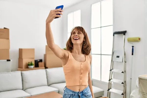 Young Caucasian Woman Smiling Confident Make Selfie Smartphone Home — ストック写真