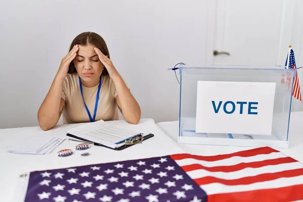 Young Brunette Woman Political Election Sitting Ballot Suffering Headache Desperate — Stock Photo, Image