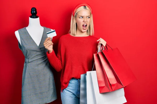 Beautiful Blonde Woman Holding Shopping Bags Credit Card Angry Mad — 图库照片