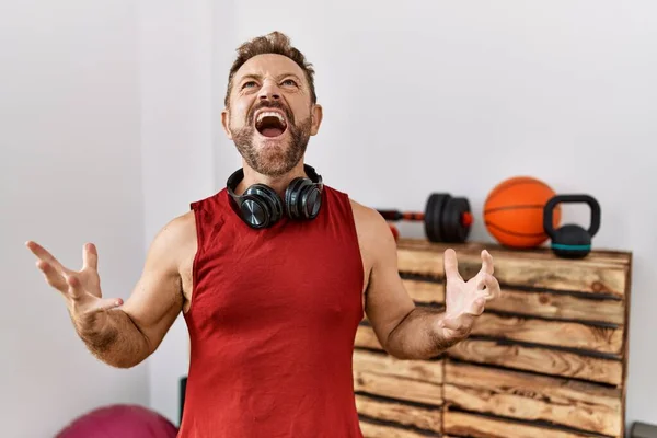 Middle Age Man Wearing Sportswear Headphones Gym Crazy Mad Shouting — Fotografia de Stock