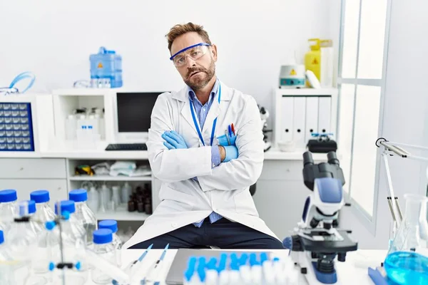 Middle Age Man Working Scientist Laboratory Skeptic Nervous Disapproving Expression — Stockfoto