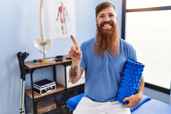 Redhead Man Long Beard Holding Foam Roller Medical Clinic Smiling — Stock Photo, Image