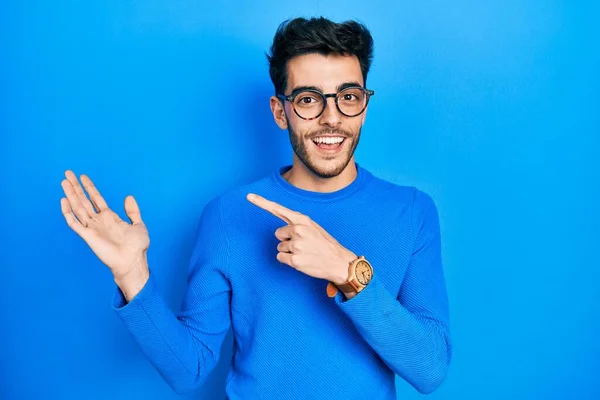 Young Hispanic Man Wearing Casual Clothes Glasses Amazed Smiling Camera — Stock Photo, Image