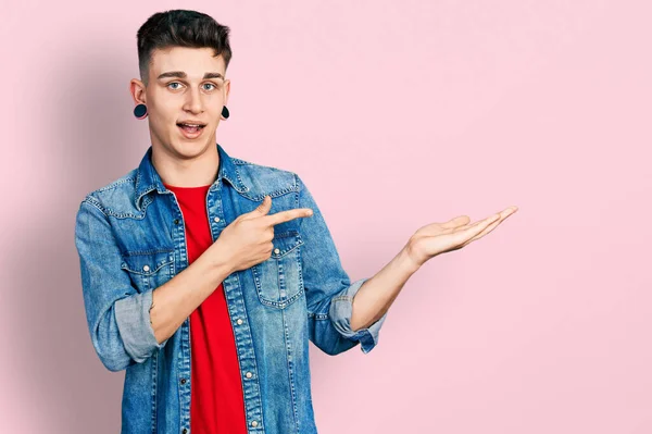 Young Caucasian Boy Ears Dilation Wearing Casual Denim Jacket Amazed — Foto Stock