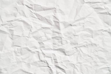 Kırışıklıkları olan beyaz buruşuk kağıt dokusu. Hasarlı ve yırtık çarşaf