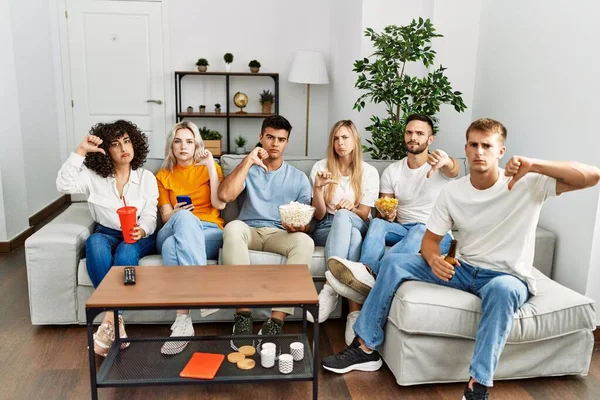 Group People Eating Snack Sitting Sofa Home Angry Face Negative — Stockfoto