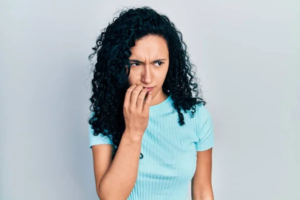 Young Hispanic Woman Curly Hair Wearing Casual Blue Shirt Looking — Fotografia de Stock