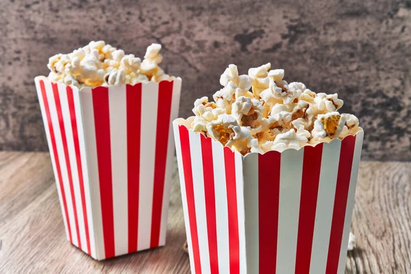Two Packs Salty Popcorns Wooden Surface — Stock Photo, Image