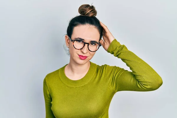 Young Hispanic Girl Wearing Casual Clothes Glasses Confuse Wonder Question — Stockfoto