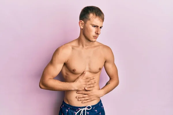 Young Caucasian Man Wearing Swimwear Hand Stomach Because Indigestion Painful — Zdjęcie stockowe