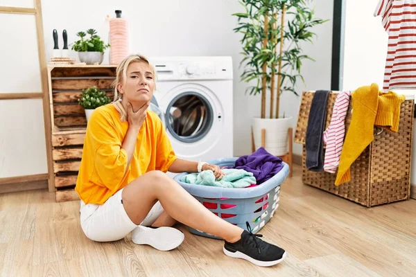 Young Caucasian Woman Putting Dirty Laundry Washing Machine Touching Painful — Stock Photo, Image