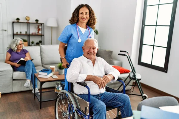 Middle Age Doctor Woman Supporting Retired Man Sitting Wheelchair Nursing — Stock Photo, Image