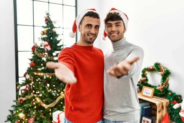 Young Gay Couple Standing Christmas Tree Wearing Hat Smiling Cheerful — Stok fotoğraf