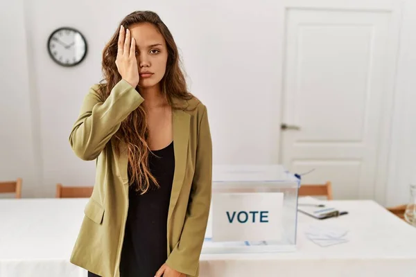 Beautiful Hispanic Woman Standing Political Campaign Room Covering One Eye — Stockfoto