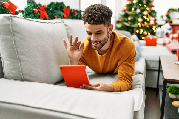Young Arab Man Having Video Call Lying Sofa Christmas Tree — Photo