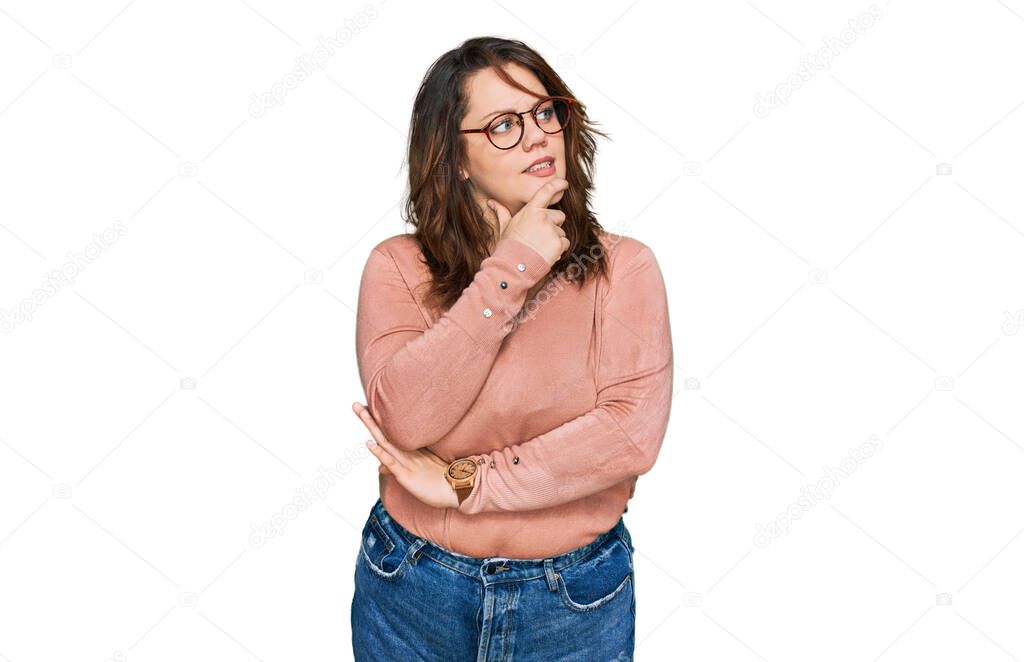 Young plus size woman wearing casual clothes and glasses thinking worried about a question, concerned and nervous with hand on chin 