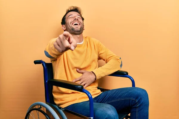 Handsome Man Beard Sitting Wheelchair Laughing You Pointing Finger Camera — Stock fotografie