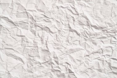 Kırışıklıkları olan beyaz buruşuk kağıt dokusu. Hasarlı ve yırtık çarşaf