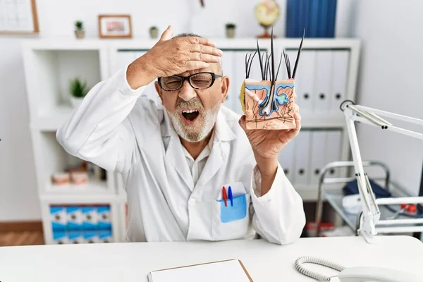 Mature Doctor Man Holding Model Human Anatomical Skin Hair Stressed — Fotografia de Stock