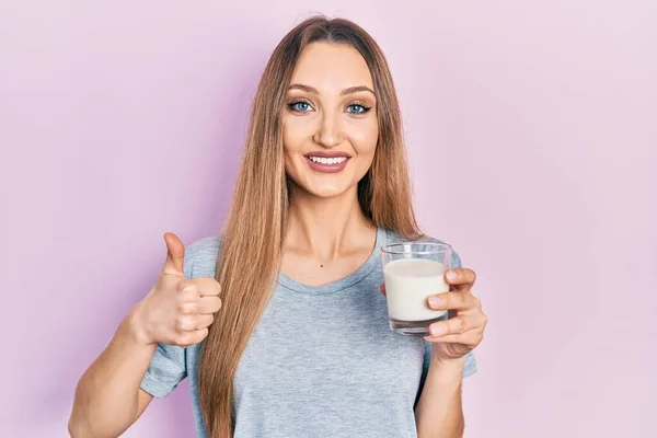 Young Blonde Girl Holding Glass Milk Smiling Happy Positive Thumb — Stok fotoğraf