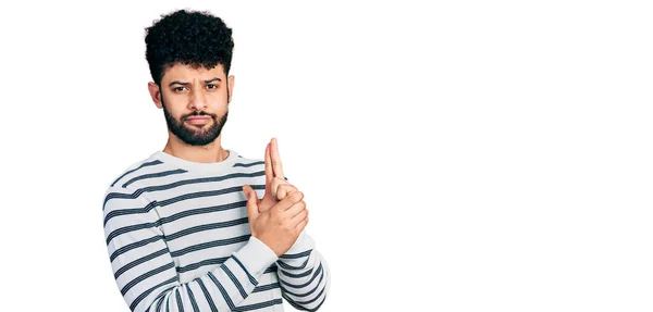 Young Arab Man Beard Wearing Casual Striped Sweater Holding Symbolic — 图库照片
