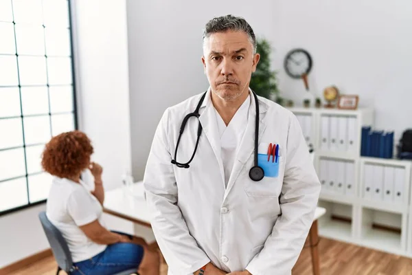 Middle Age Doctor Man Clinic Patient Skeptic Nervous Frowning Upset — Fotografia de Stock