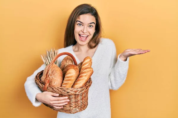 Young Caucasian Girl Holding Wicker Basket Bread Celebrating Achievement Happy — 图库照片