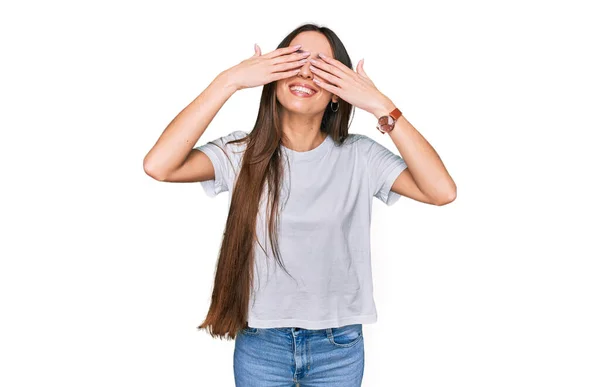 Young Hispanic Girl Wearing Casual White Shirt Covering Eyes Hands — 图库照片