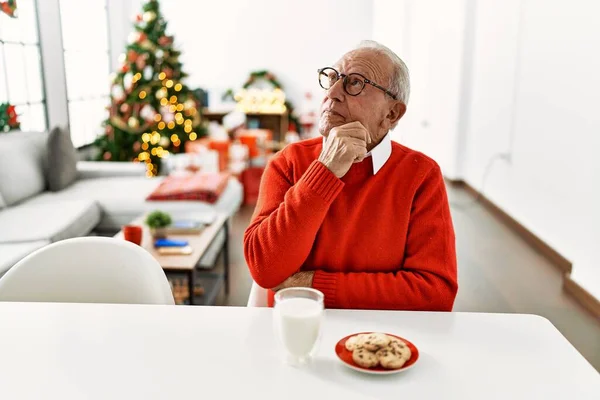 Senior Man Grey Hair Sitting Table Cookies Christmas Tree Serious — Stock fotografie