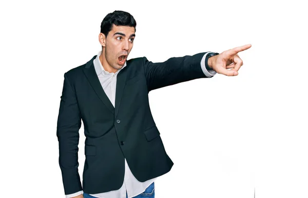 Handsome Hispanic Man Wearing Business Clothes Pointing Finger Surprised Ahead — Stockfoto