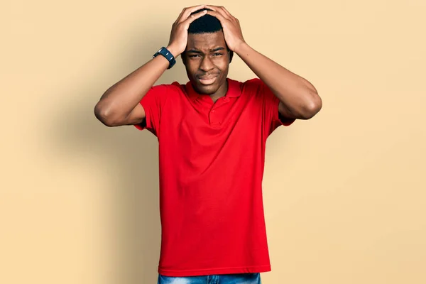 Young African American Man Wearing Casual Red Shirt Suffering Headache — Stock Photo, Image