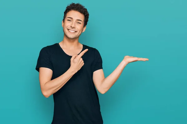 Young Handsome Man Wearing Casual Black Shirt Amazed Smiling Camera — Stock Photo, Image