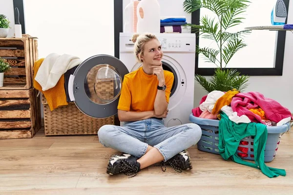 Young Blonde Woman Doing Laundry Sitting Washing Machine Hand Chin — Fotografia de Stock