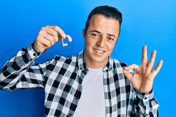 Handsome Young Man Holding Medical Hearing Aid Doing Sign Fingers — Foto de Stock