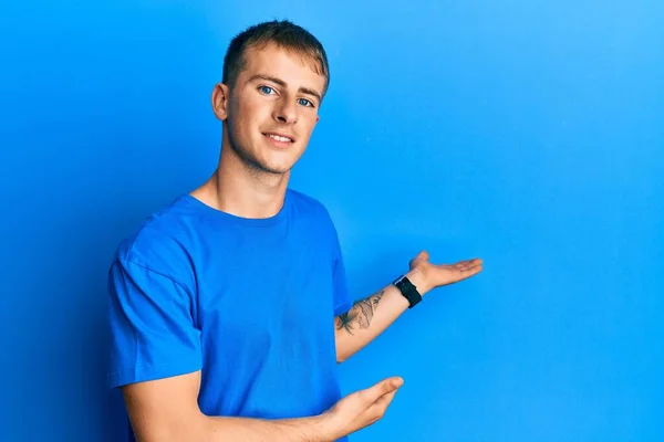 Young Caucasian Man Wearing Casual Blue Shirt Inviting Enter Smiling — Stock Fotó