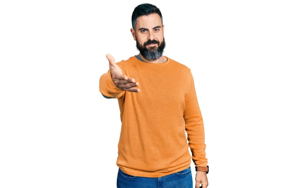 Hispanic Man Beard Wearing Casual Winter Sweater Smiling Cheerful Offering — Zdjęcie stockowe