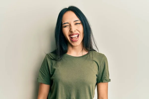 Young Hispanic Girl Wearing Casual Shirt Winking Looking Camera Sexy — Stockfoto