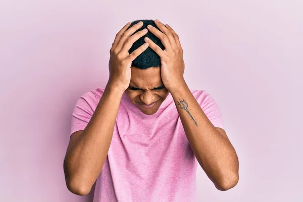 Young Handsome Hispanic Man Wearing Casual Pink Shirt Suffering Headache — Stock Photo, Image
