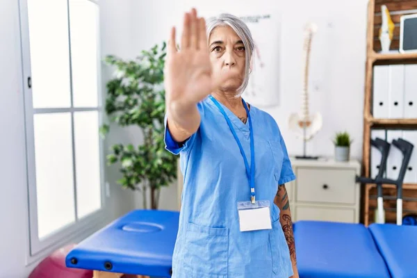 Middle Age Grey Haired Woman Wearing Physiotherapist Uniform Medical Clinic — Stock Photo, Image