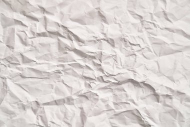 Kırışıklıkları olan beyaz buruşuk kağıt dokusu. Hasarlı ve yırtık çarşaf