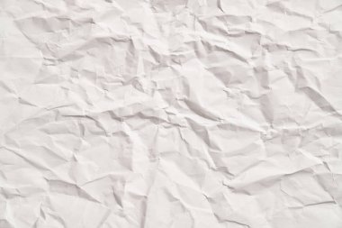 Kırışıklıkları olan beyaz buruşuk kağıt dokusu. Hasarlı ve yırtık çarşaf